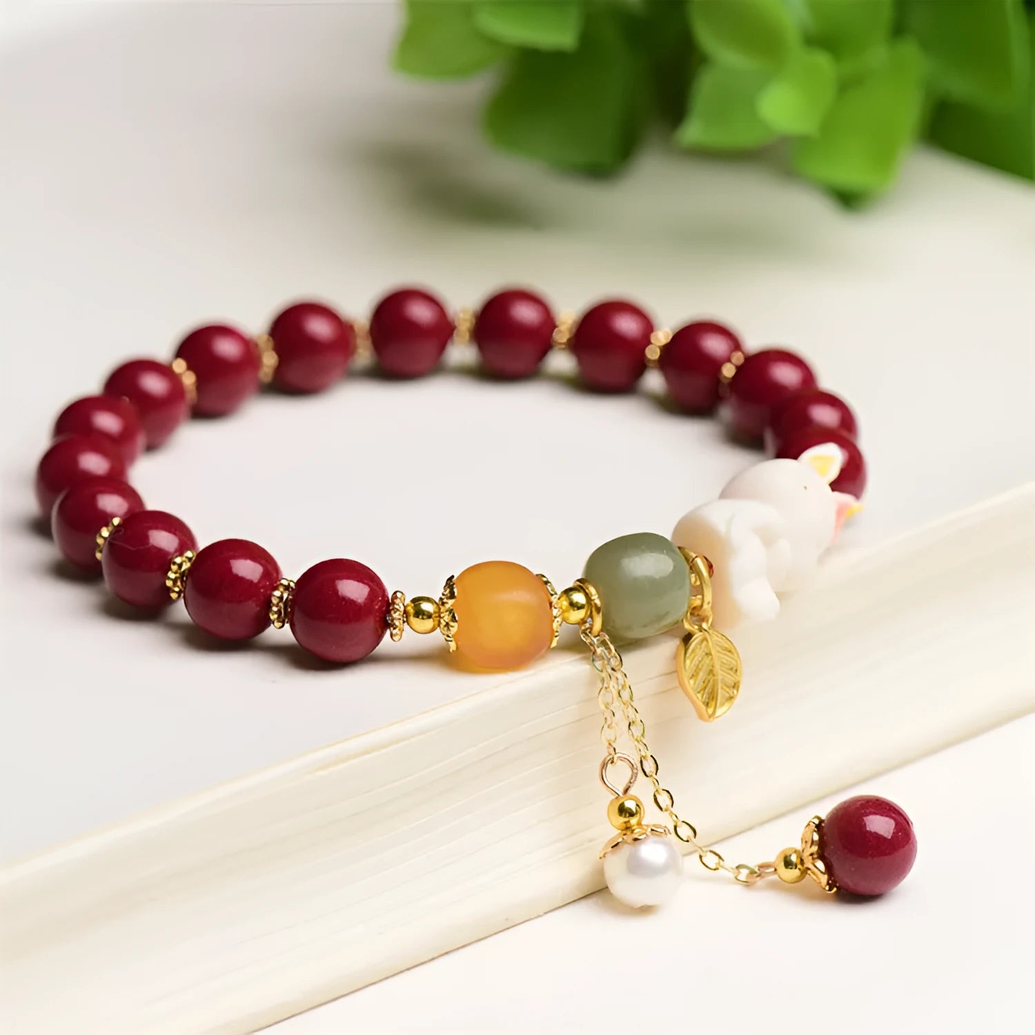Traditional Chinese cinnabar bracelet with rabbit charm in 8mm or 10mm bead sizes