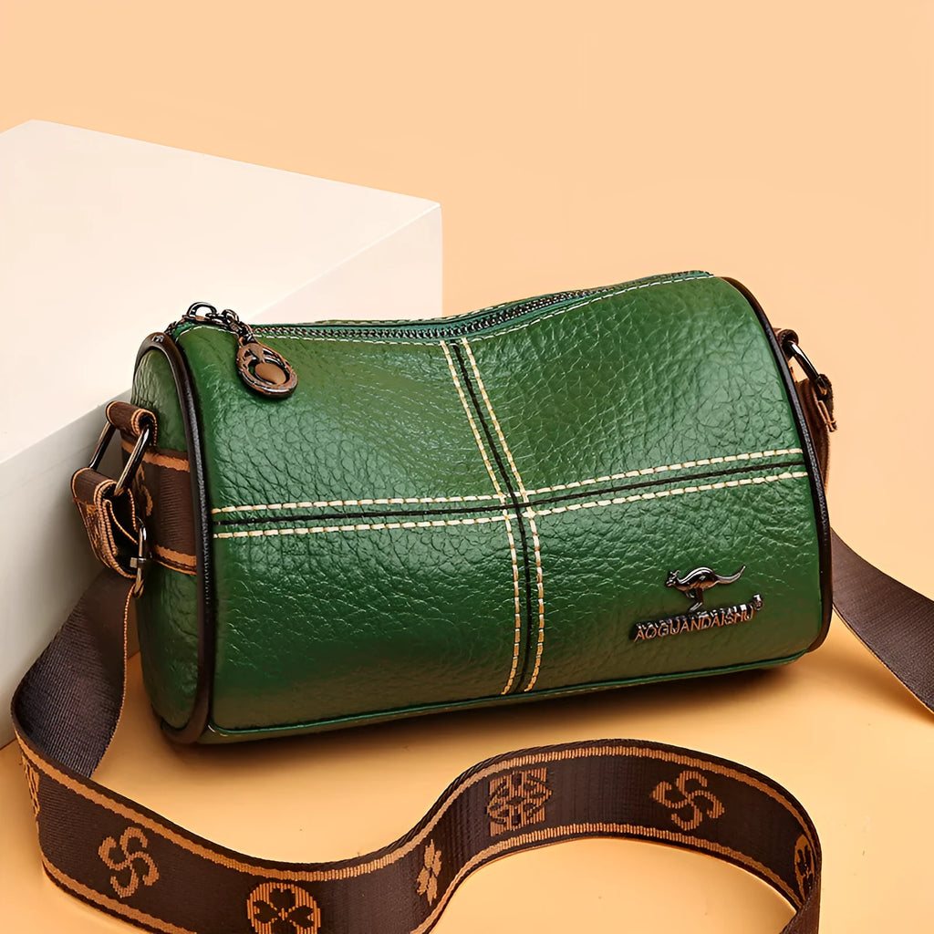 Casual genuine leather cylindrical shoulder bag for women in black, top grain, patchwork, soft texture.