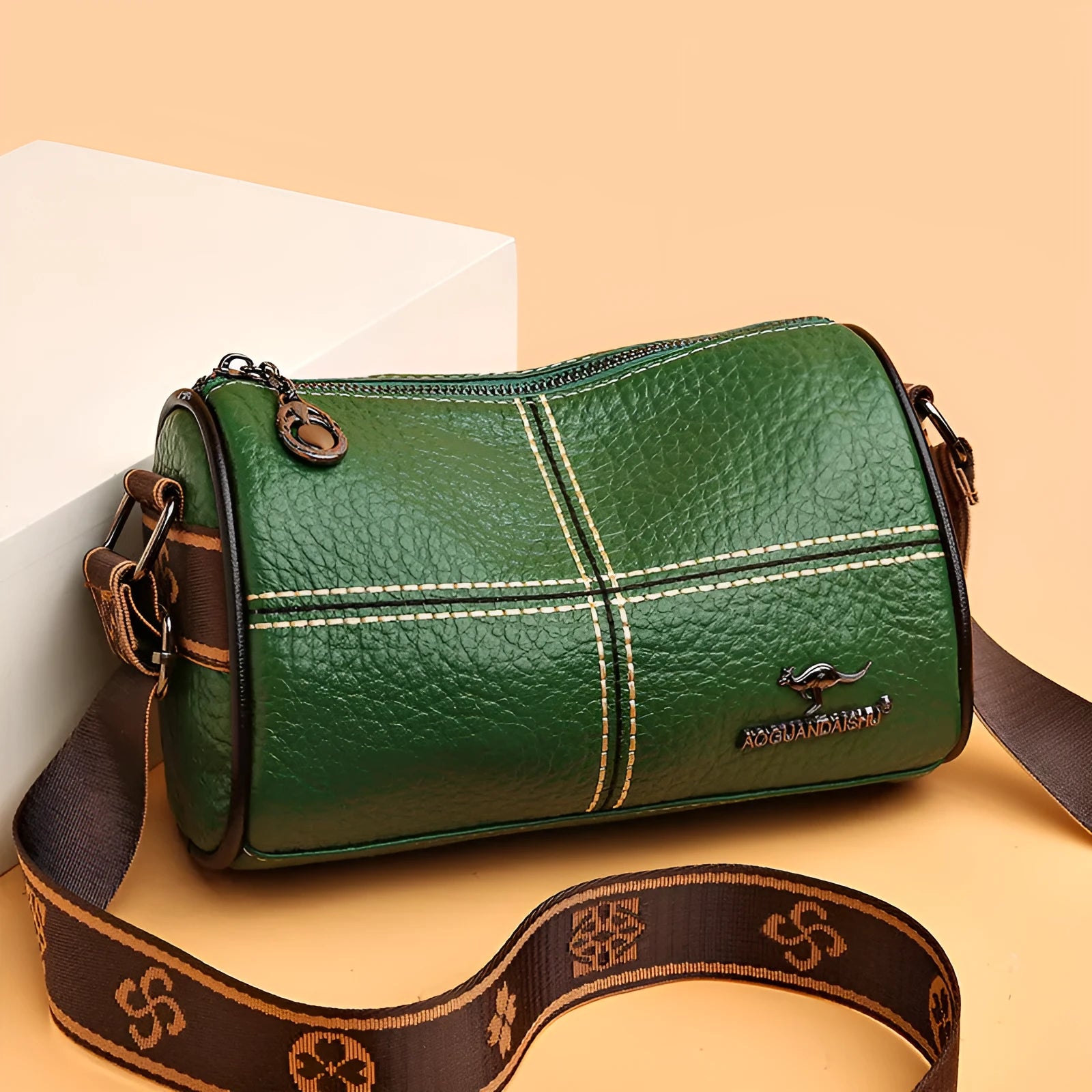 Casual genuine leather cylindrical shoulder bag for women in black, top grain, patchwork, soft texture.