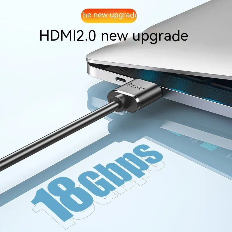 A thin, flexible black HDMI cable with gold-plated connectors on a white background.