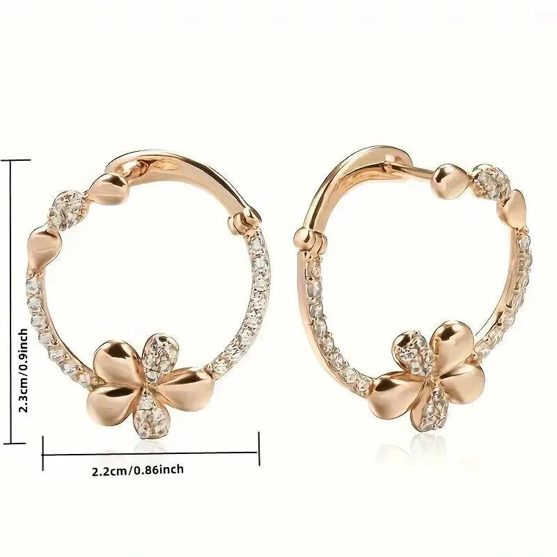 A pair of geometric round ring earrings for women in an electroplated copper finish.