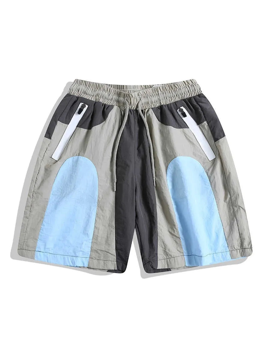 Blue patchwork quick-drying beach shorts with loose straight-leg fit and micro-elastic waistband