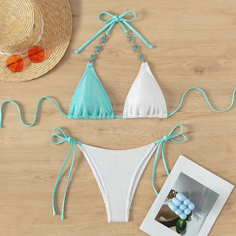 Women's colour matching lace-up swimsuit bikini with pearl chain detail on front.