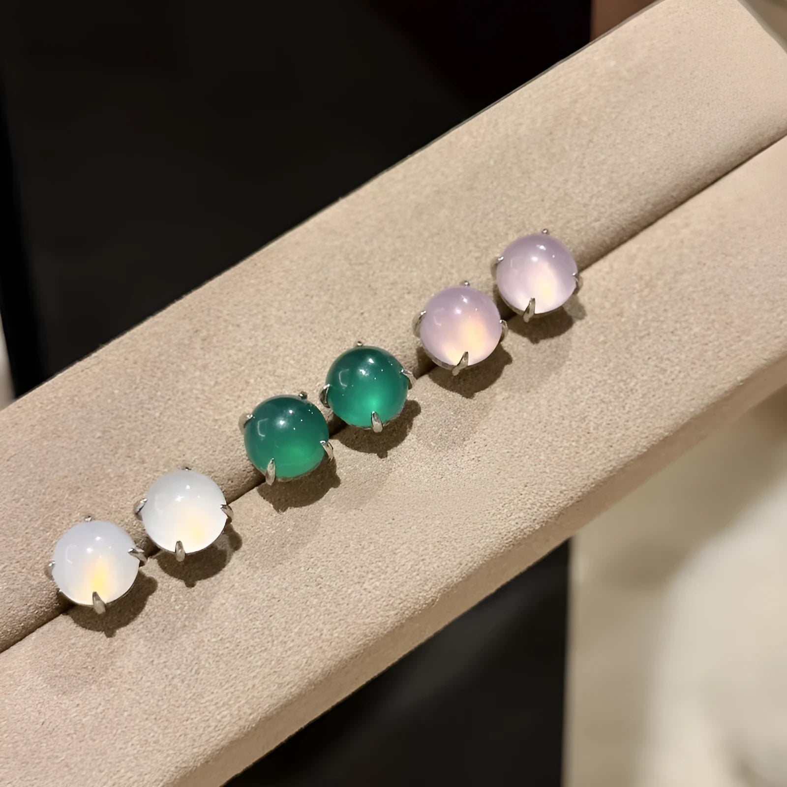 Round egg surface chalcedony stud earrings with four-claw copper setting in emerald green colour