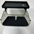 Black ABS plastic storage box installed under the screen of a Tesla Model Y centre console.
