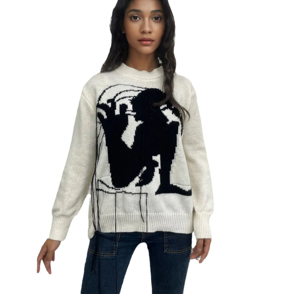 Women's grey alpaca wool pullover sweater with tassel detailing and abstract pattern