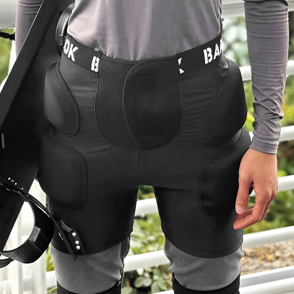 Black sports hip protector with NBR foam padding on spandex base for skating and skiing safety