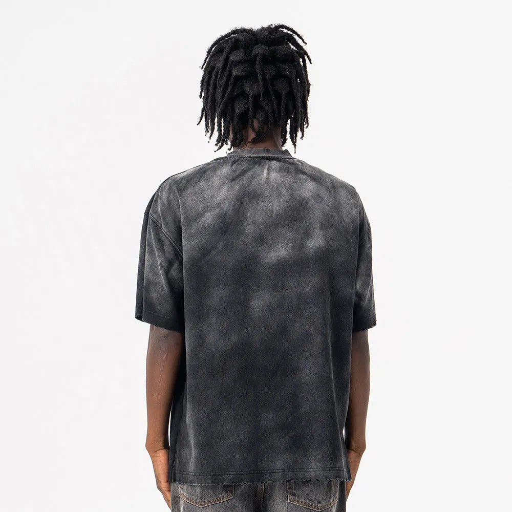 Black men's cotton t-shirt with printed letter design and loose drop-shoulder sleeves.