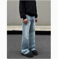 Men's blue straight leg jeans with a retro whisker wash, showing flared leg and visible stitching.