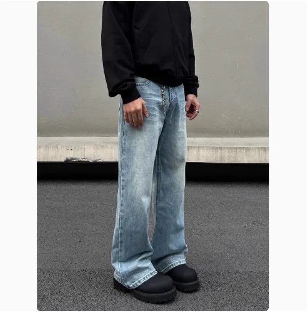 Men's blue straight leg jeans with a retro whisker wash, showing flared leg and visible stitching.
