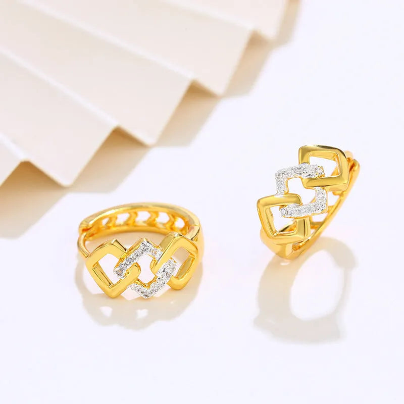 Gold geometric hollow-out earrings with colour separation detail on ear clip