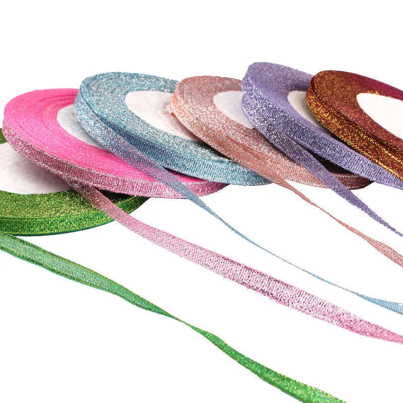 Roll of 0.6cm wide polyester gift ribbon in multiple colour options including gold leaf and red onion.