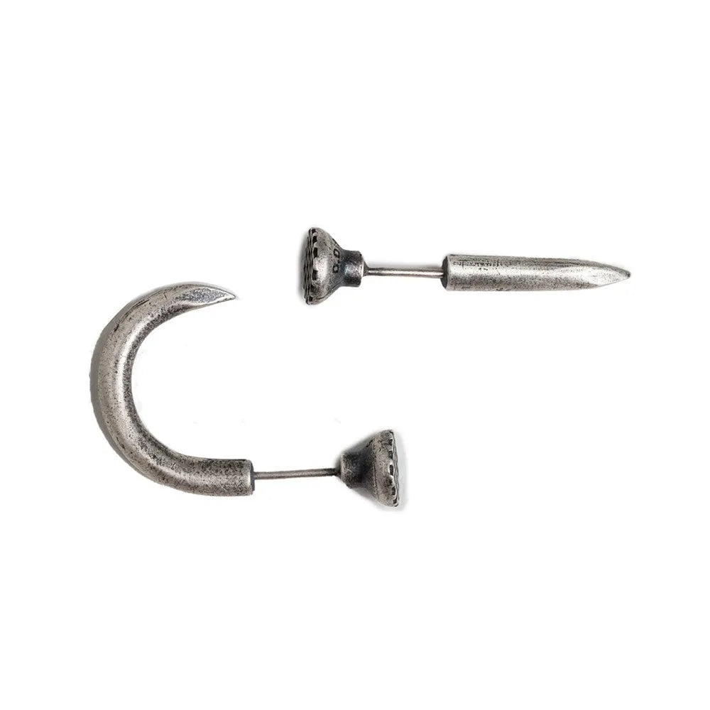 Sterling silver punk-style nail stud earrings on ear hook, showing straight and curved nail designs.