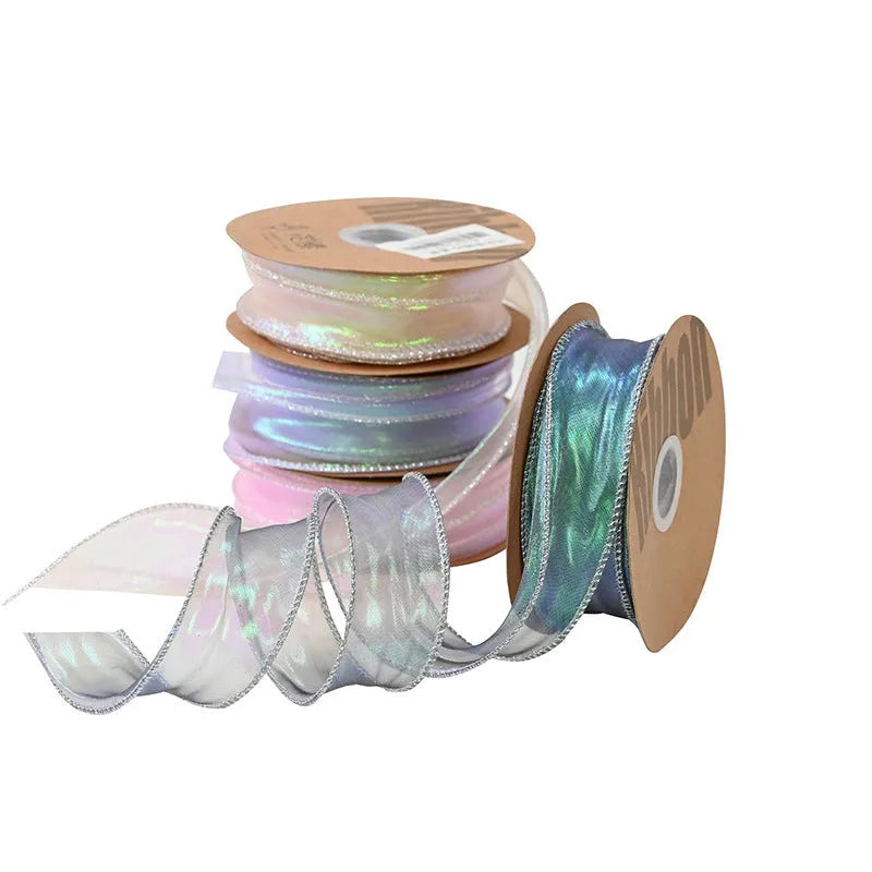 Roll of colourful fishtail yarn mesh ribbon with wave pattern, showing 4cm width.