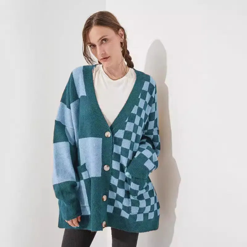 Grey loose fit knitted cardigan with a printed checks pattern, showing regular sleeves and a slim silhouette.