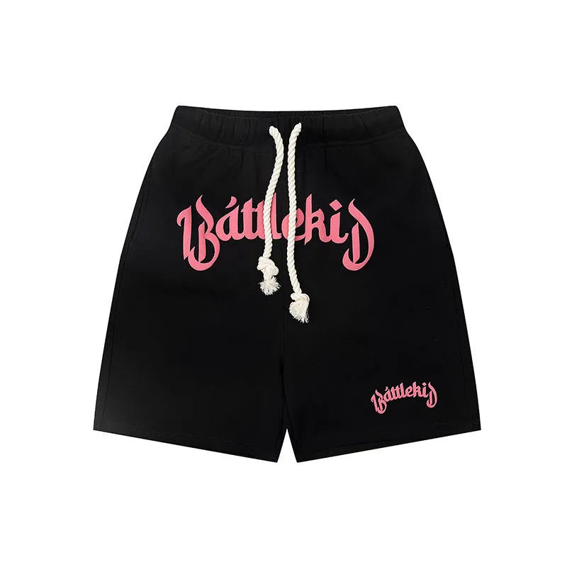 Men's loose cotton blend cropped shorts in grey, shown in a casual setting