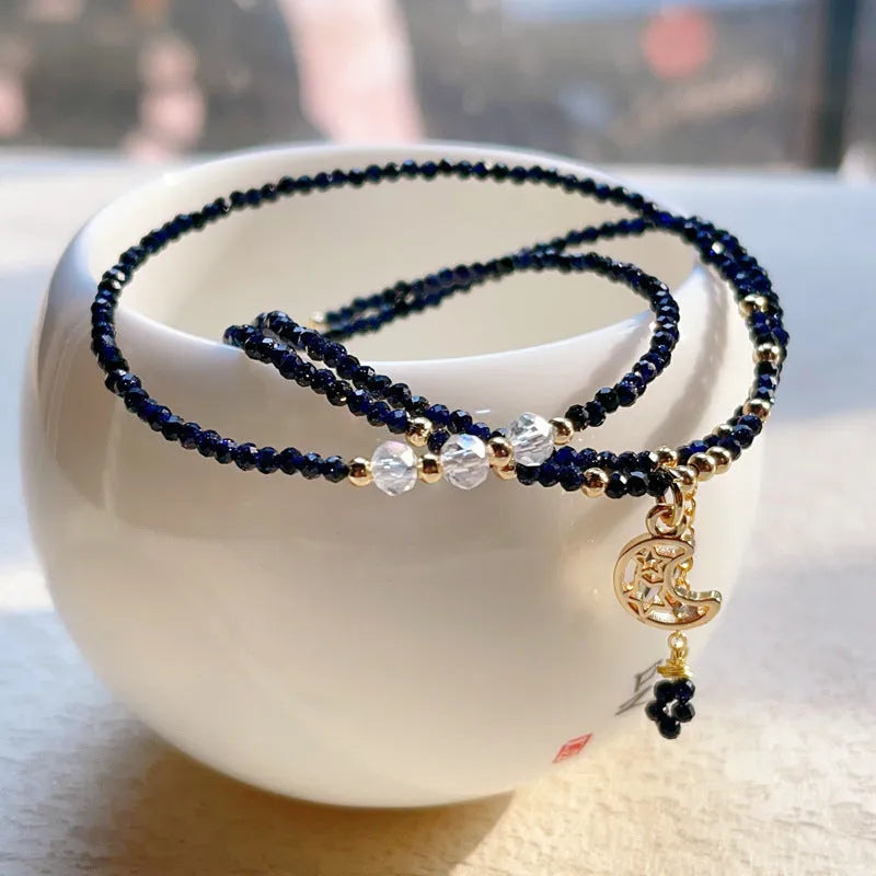 Blue sand stone three-ring multi-layer bracelet for women on a wrist.