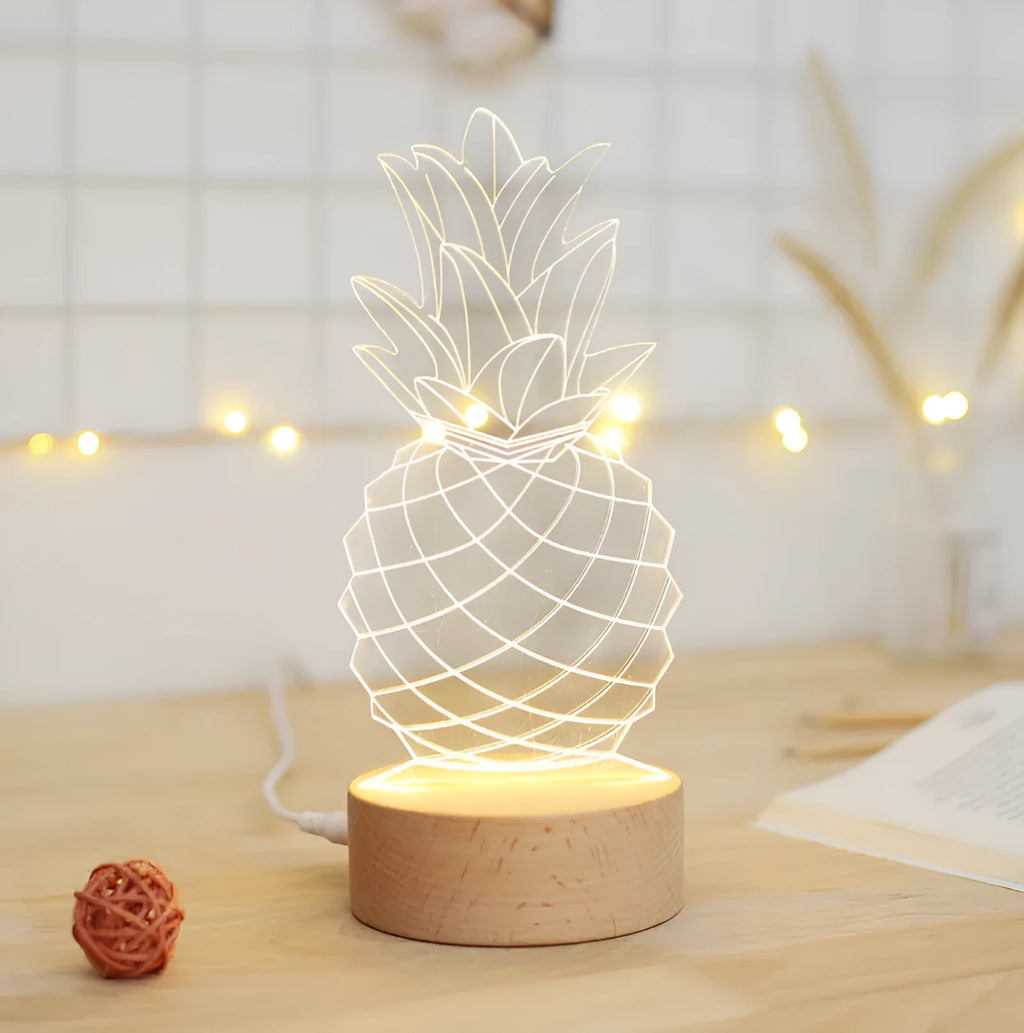 Wooden and acrylic pineapple-shaped USB table lamp with dimmer switch on a bedside table.