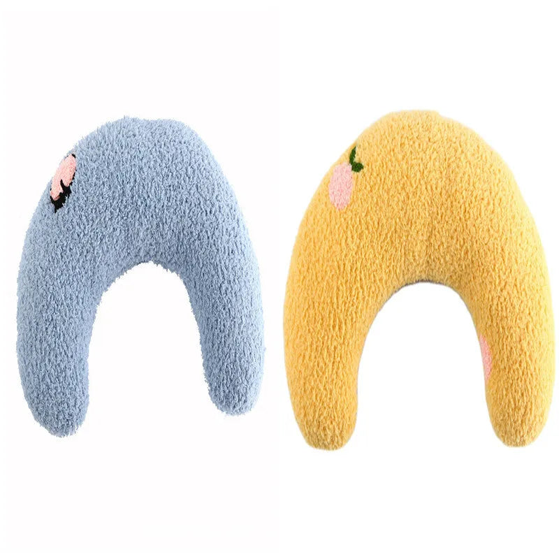 Small U-shaped plush pet pillow in blue for cats and small dogs, showing quilted faux fur texture.