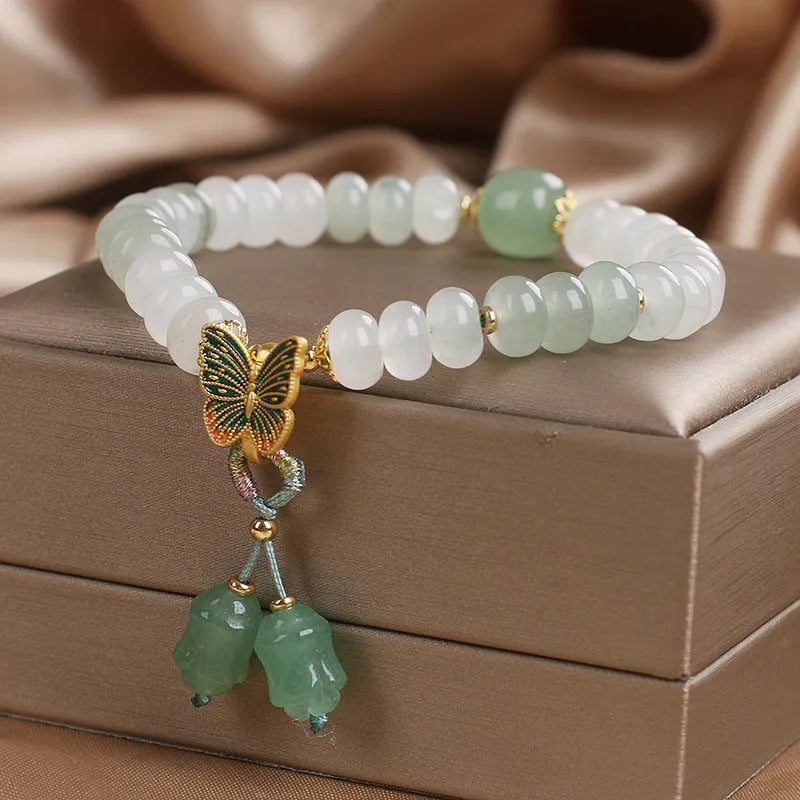 Green Tian Shan Cui abacus bead bracelet with retro butterfly tassel and pearl accents