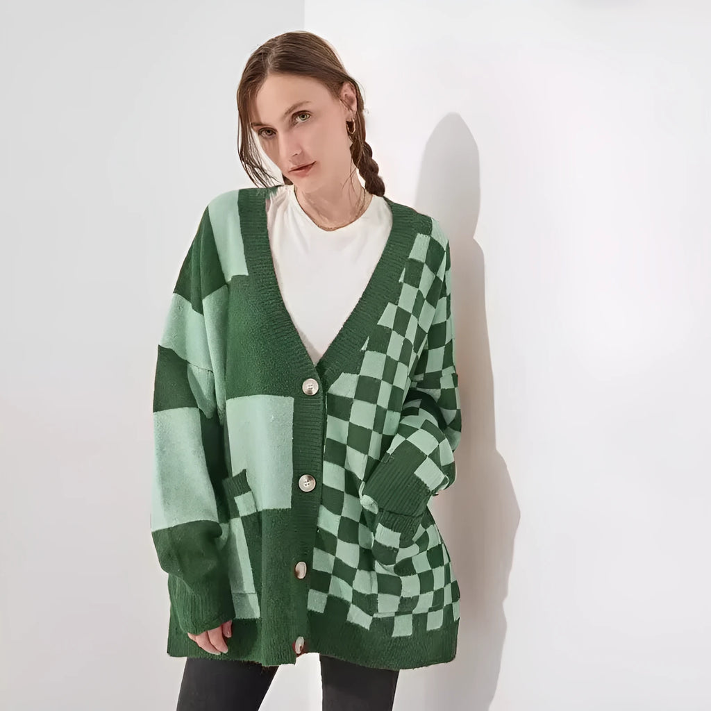 Grey loose fit knitted cardigan with a printed checks pattern, showing regular sleeves and a slim silhouette.