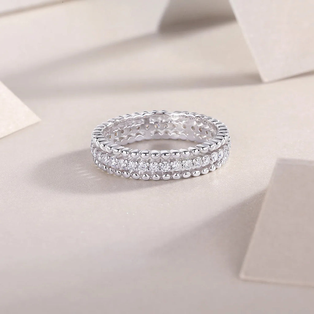 Moissanite wedding ring set in gold colour S925 silver with platinum plating on white background