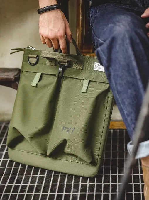 Medium canvas crossbody messenger bag in military green with zipper closure and shoulder strap