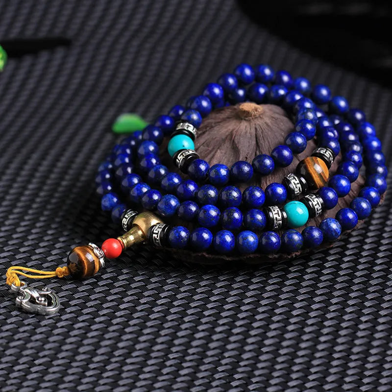Natural Lapis Lazuli 108 bead bracelet in 8mm size on unisex wrist showing deep blue stone beads