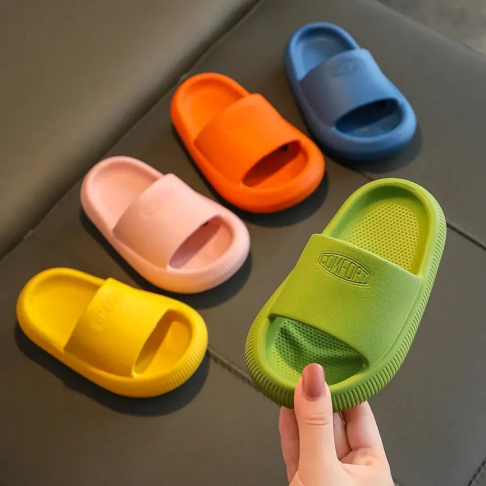 Children's EVA literal slippers with injection moulded soles in mixed colours showing non-slip wear-resistant design