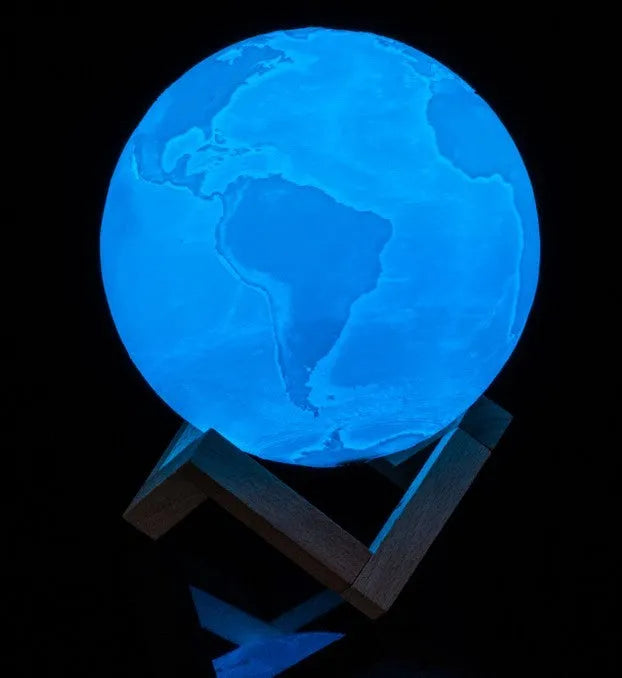 3D-printed white moon lamp on wooden stand with touch-sensitive metal ring base