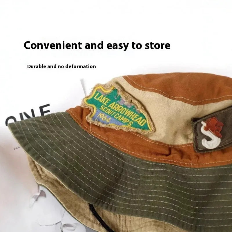 Army green women's foldable cotton fisherman hat with retro patchwork design and flat crown.