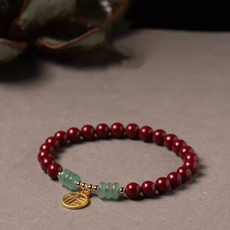 Handmade wave-shaped bracelet made from cinnabar and copper beads in a national unisex style.