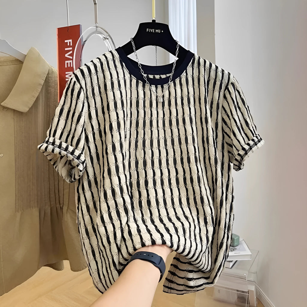 Black men's loose-fitting striped short sleeve pullover top made from silk and linen blend.