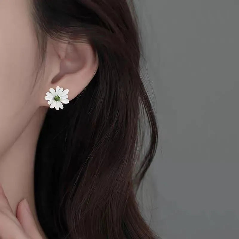 Women's alloy cartoon flower stud earrings showing blue and orange, white and green, and yellow and white colour combinations