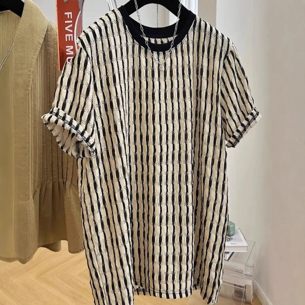 Black men's loose-fitting striped short sleeve pullover top made from silk and linen blend.