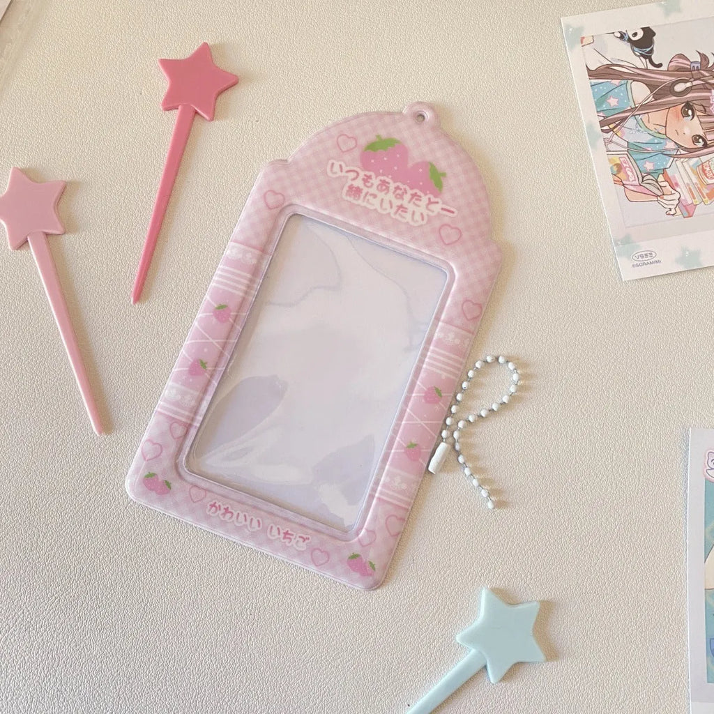 Cartoon strawberry or four-leaf clover PVC card holder measuring 7.6 by 13.6 centimetres.