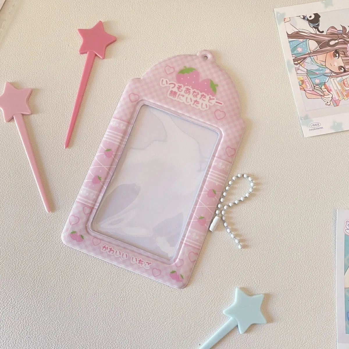 Cartoon strawberry or four-leaf clover PVC card holder measuring 7.6 by 13.6 centimetres.