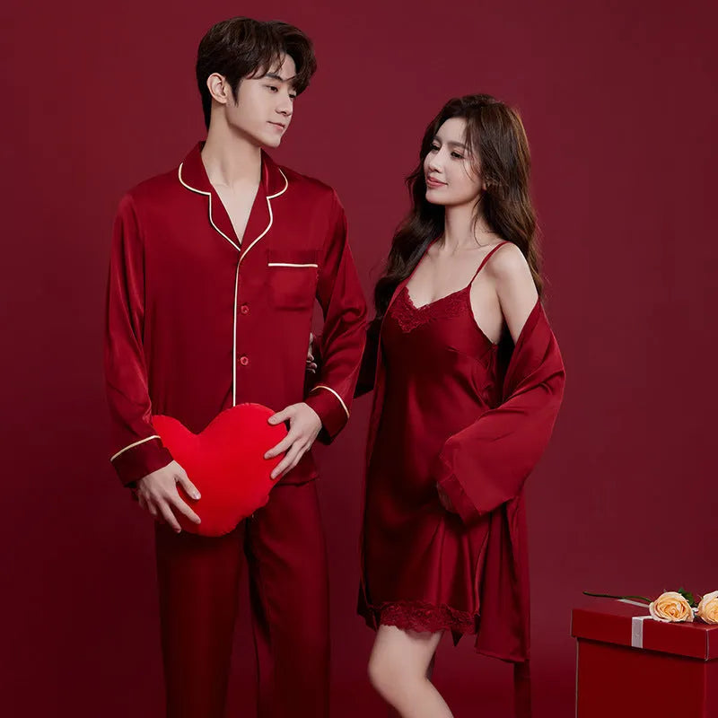 Red long-sleeve ice silk sleepwear set for a man and woman on hangers.
