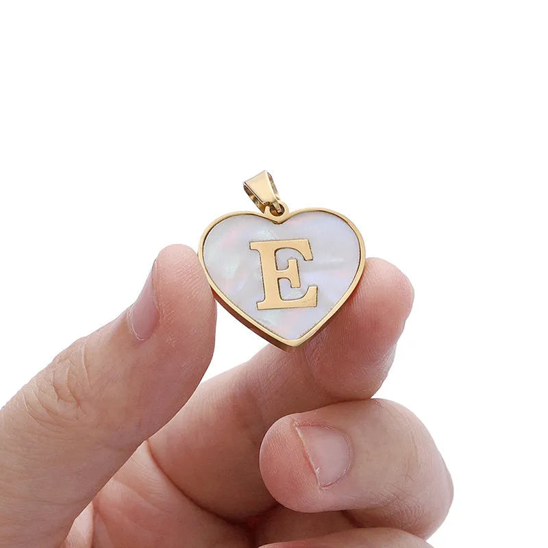 Gold plated heart necklace with white shell detail on an adjustable chain