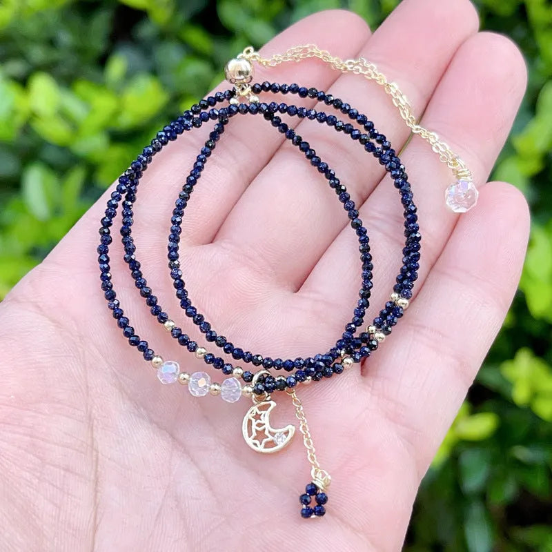 Blue sand stone three-ring multi-layer bracelet for women on a wrist.