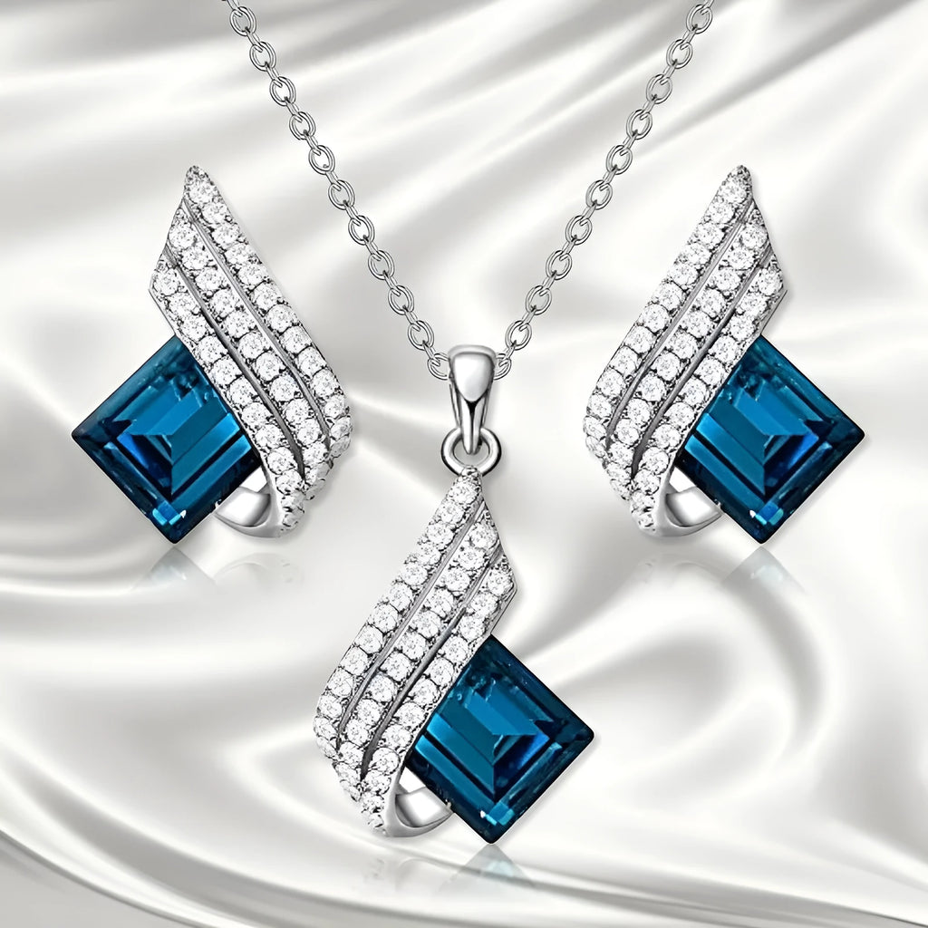 Necklace and earrings jewellery set with alloy pendant and glass details on cross chain