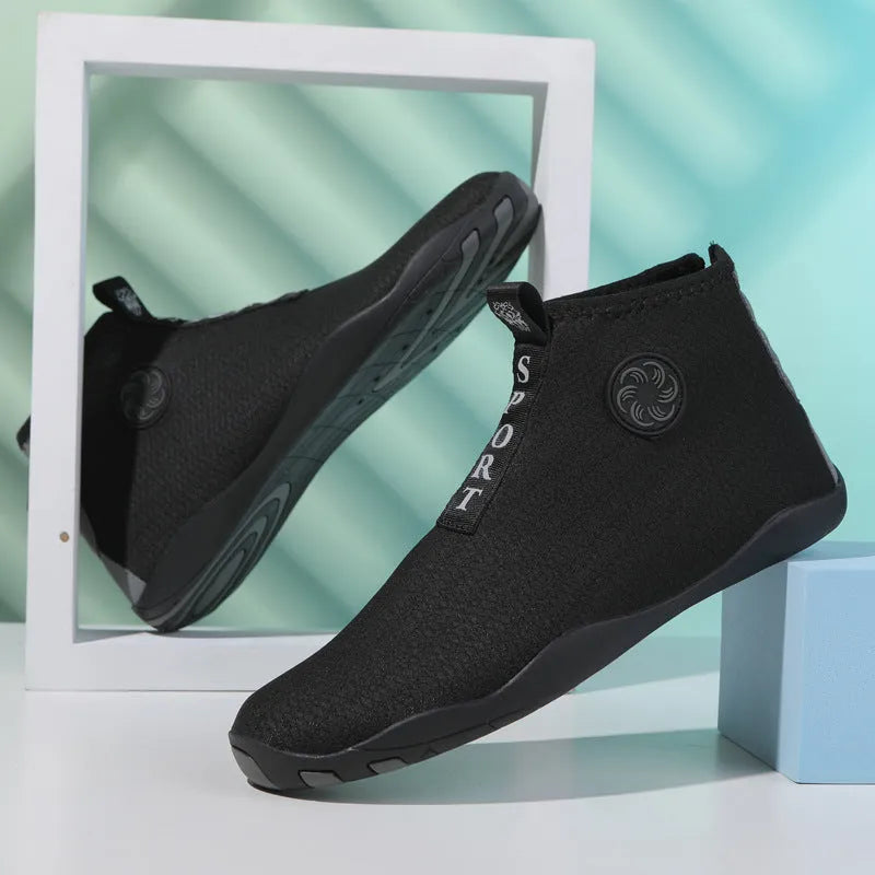 Mid-top beach shoes in black and fluorescent green colour with mesh fabric upper and rubber sole