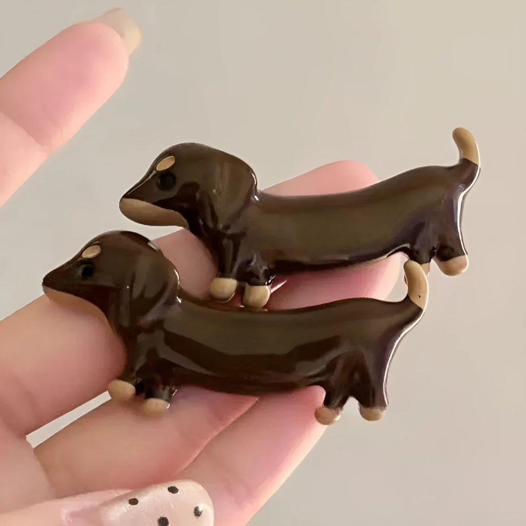Cute dachshund dog design hair barrettes with an electroplated metallic finish.