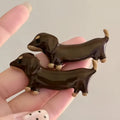 Cute dachshund dog design hair barrettes with an electroplated metallic finish.