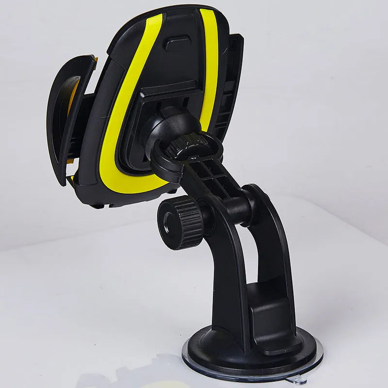 Red ABS suction cup U-shaped mobile phone bracket mounted on car dashboard holding smartphone