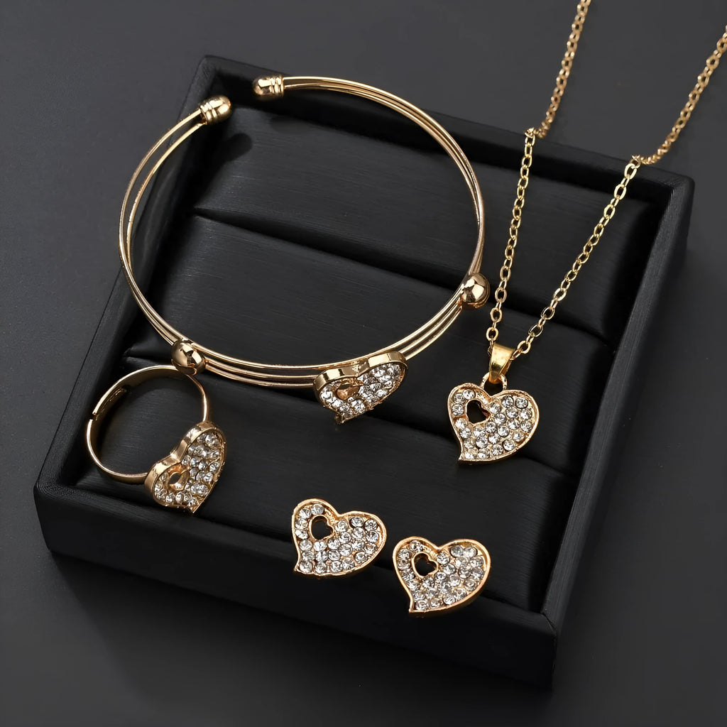 Gold alloy jewellery set with love, water drop and bell charms including earrings, pendant and bracelet