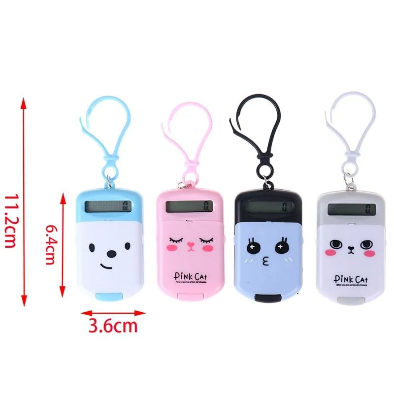 Creative cookie-shaped cute mini plastic calculator in black with key ring on a desk