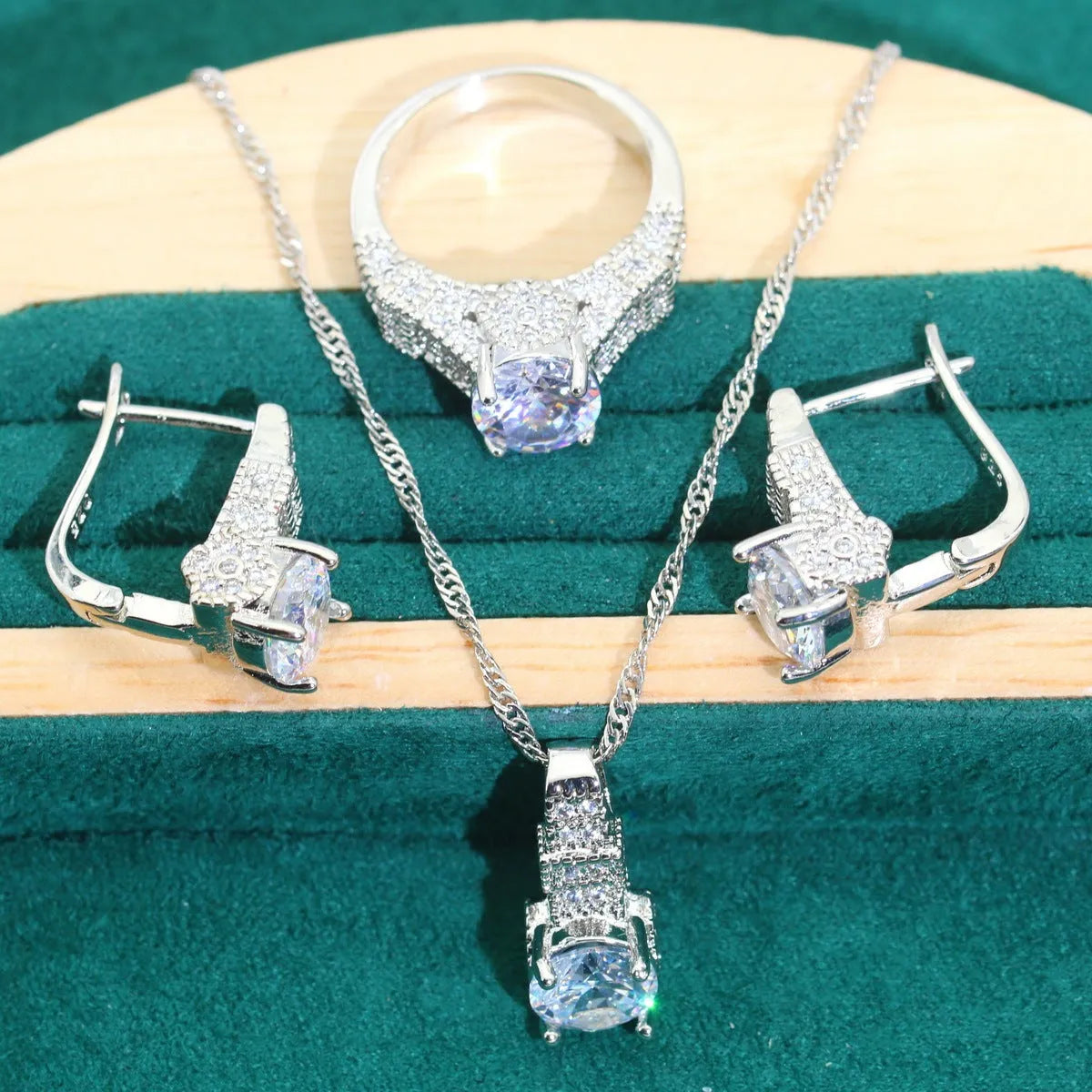 Bridal jewellery set with zircon accents showing necklace, earrings, ring, and bracelet in alloy construction