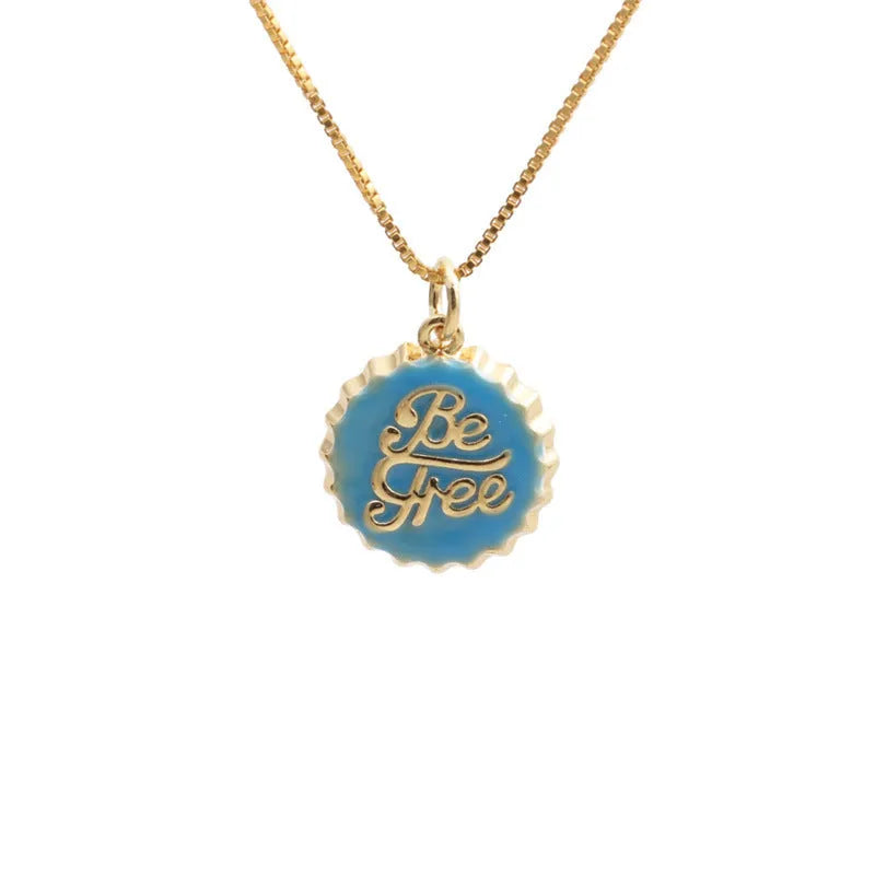 Gold-plated copper Be Free bottle cap pendant necklace on a 40cm box chain.