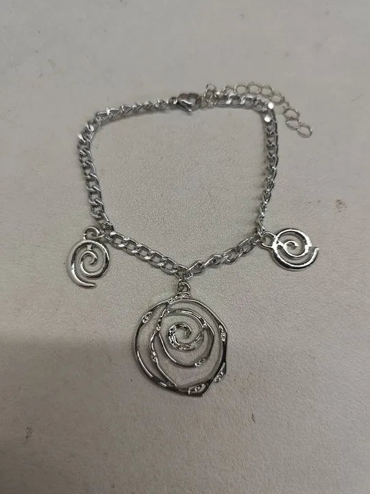 Spiral donut geometric jewellery set with necklace, bracelet, and ear hooks in gold or silver electroplated finish